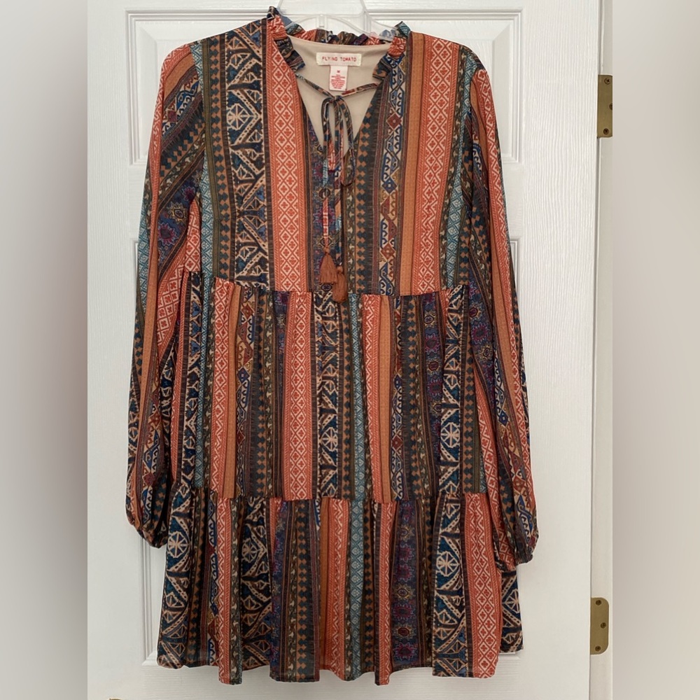 Flying Tomato Mini dress crafted with lightweight printed fabric. Fall colors